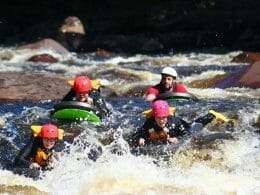 Water sledding in the rapids of the Jacques-Cartier River - Rafting Valcartier