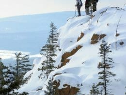 Snowshoers at the summit in winter