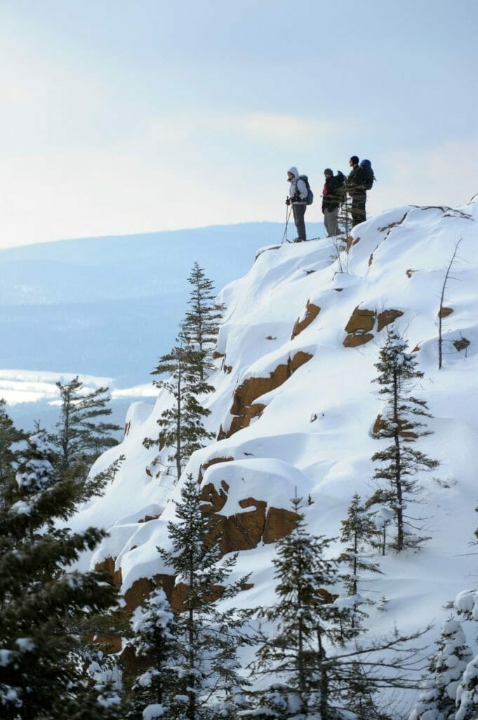 Snowshoers at the summit in winter