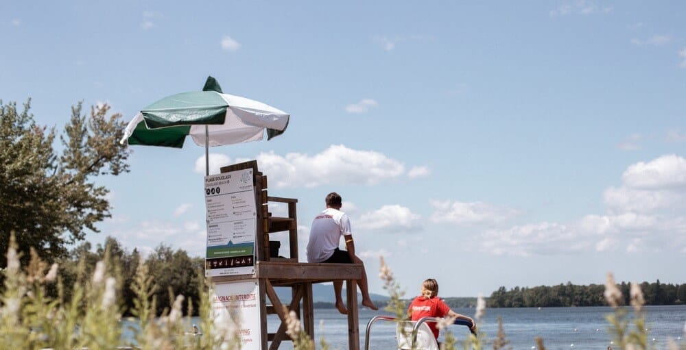 Lifeguards on their chairs at Douglas Beach in Brome Lake