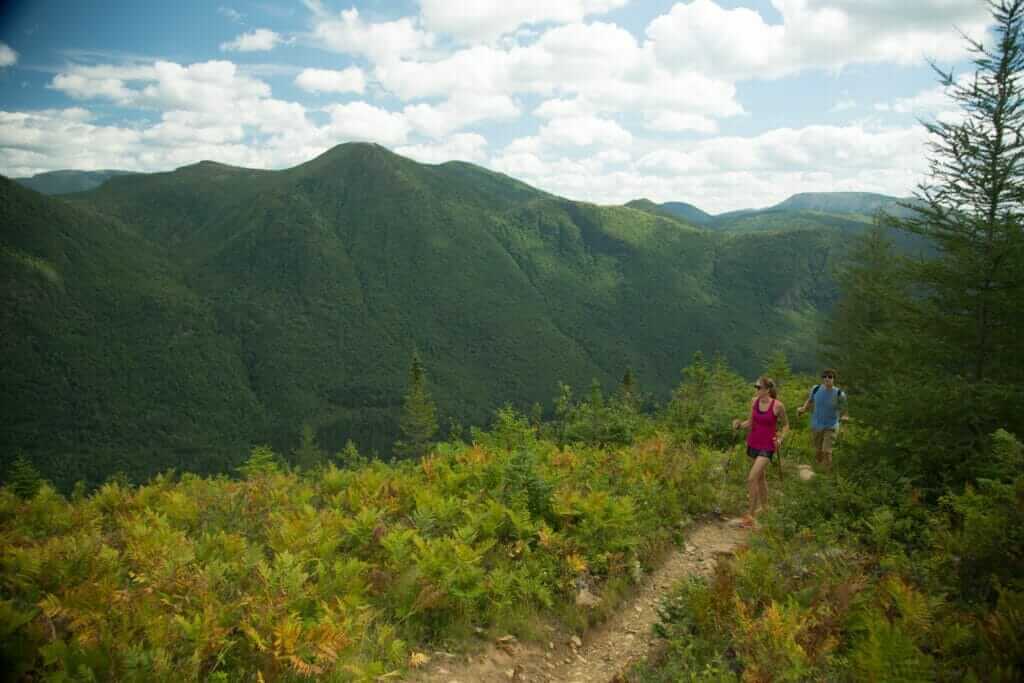 Hiker on a trail in the mountains of the Parc de la Gaspésie