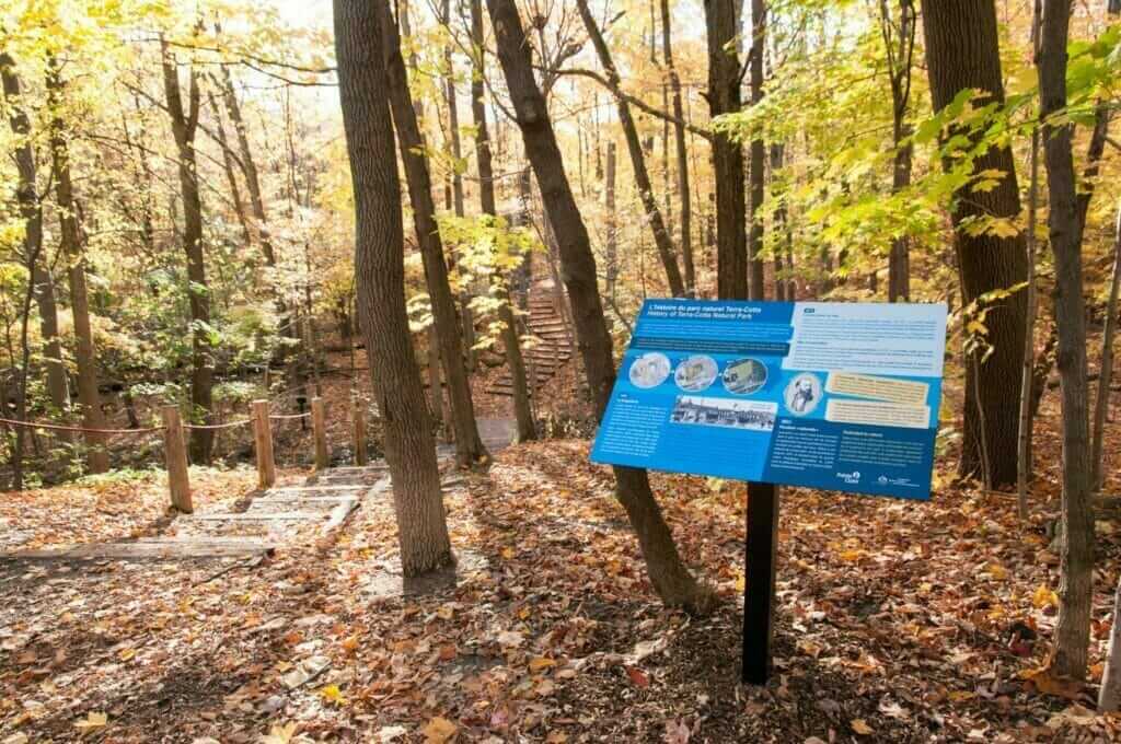 Trail with interpretation panel at Terra Cotta nature park in Pointe-Claire