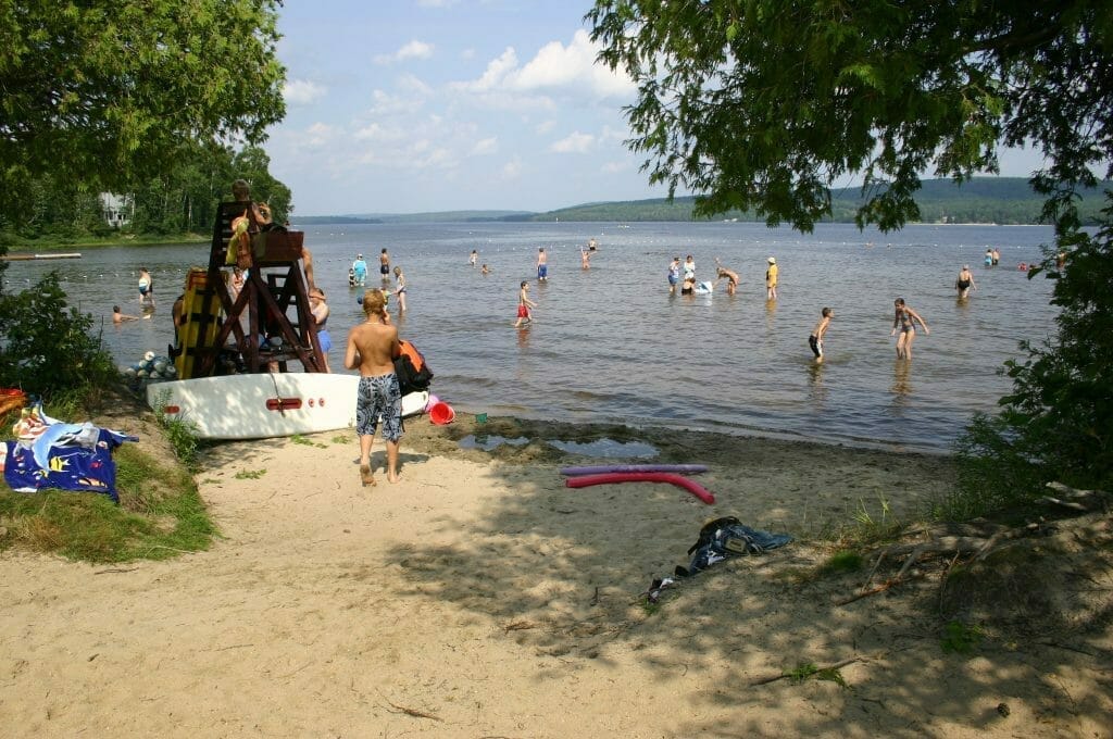 Swimming at the beach of Grand lac Nominingue